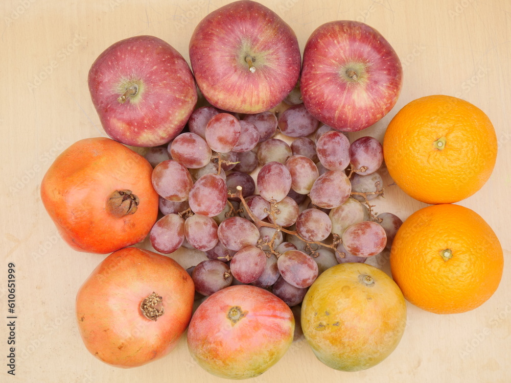 Fruits Decoration,overhead view, apples ,oranges ,pomegranate,mango,grapes Fruits Decoration,overhead view, apples ,oranges ,pomegranate,mango,grapes