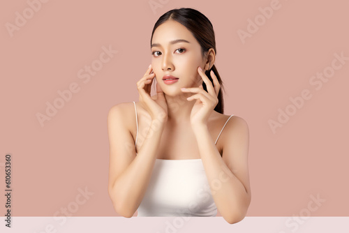 Studio shot of Beautiful young Asian woman with clean fresh skin on pink background, Face care, Facial treatment, Cosmetology, beauty and spa.