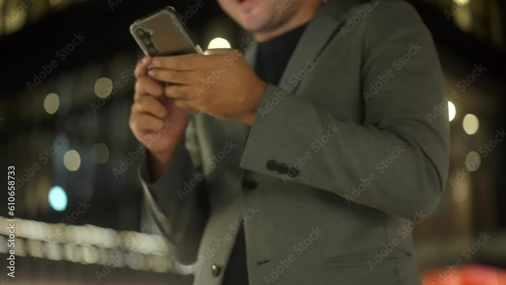 Close-up hand using smartphone to communication of business and play social media and walk in a cityscape adorned with towering buildings a blend of urban landscapes night light. Close-up hand using smartphone to communication of business and play social media and walk in a cityscape adorned with towering buildings a blend of urban landscapes night light.