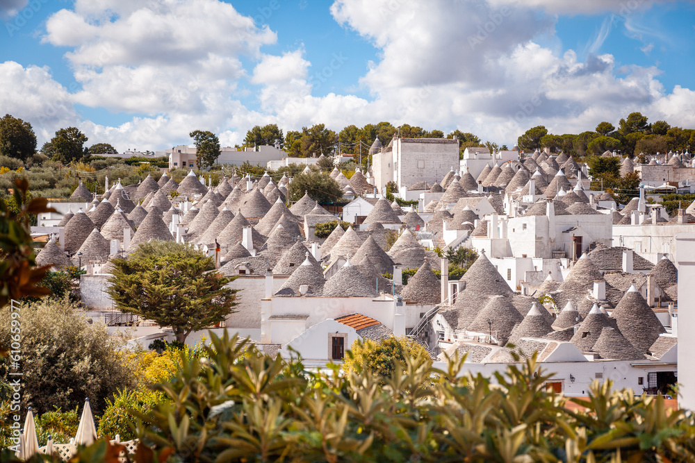 Fototapeta premium Panoramic view of Rione Monti (Monti quarter), Alberobello, Bari, Italy. The quarter stretches south of the city center and counts about one thousand trulli houses.