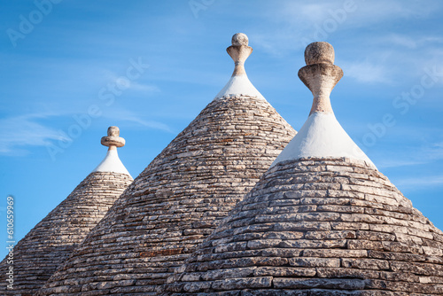 Conical roofs of trulli houses with traditional pinnacles   Alberobello  Bari  Italy.
