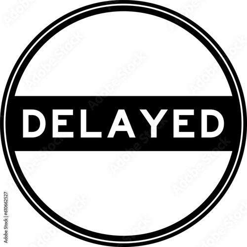 Black color round seal sticker in word delayed on white background