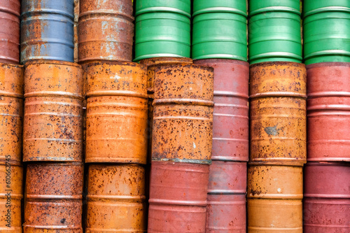 dented rusty colorful barrels