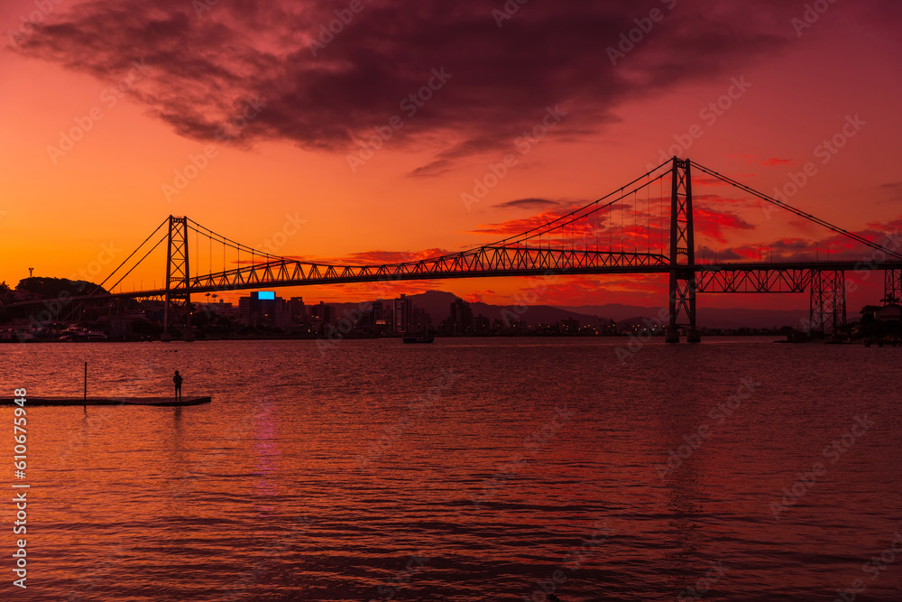 Hercilio luz bridge and warm sunset with colorful sky in Florianopolis