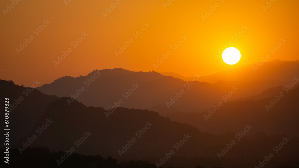 Landscape of mountains during a vivid sunset in Luang Prabang, Laos