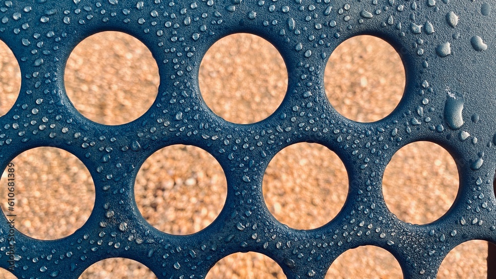the background features circular shapes and droplets of water. the background features circular shapes and droplets of water.