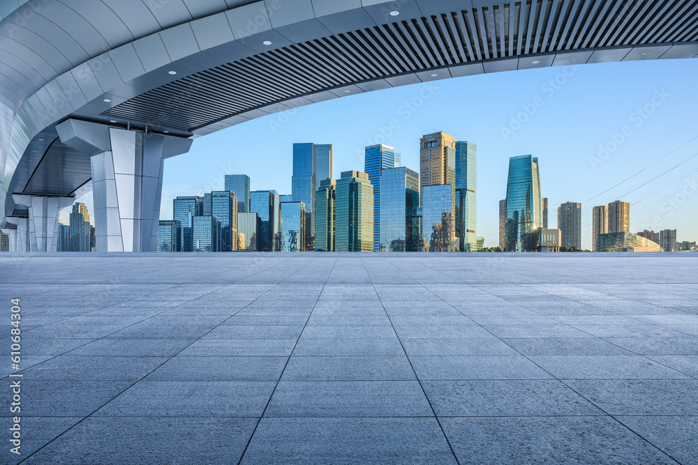 Fototapeta premium Empty square floor and bridge with city skyline scenery