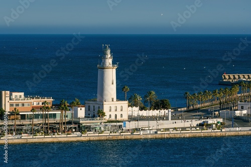 MALAGA, SPAIN - March 08, 2023. Lighthouse Farola in Malaga port © Jiri Castka