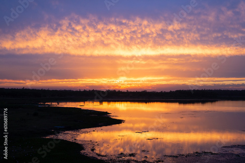 Sunset over water body