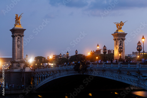 Pont Alexandre III Bridge and illuminated lamp posts at sunset. 7th Arrondissement, Paris, France