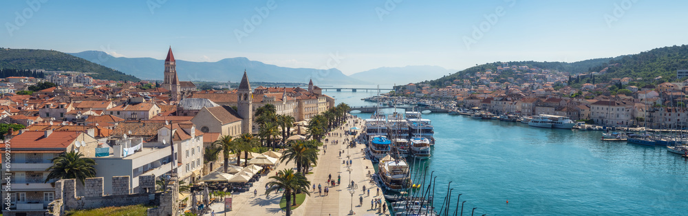 Aerial panoramic view with picturesque town of Trogir in Croatia, promenade, bridges and old town with historical buildings