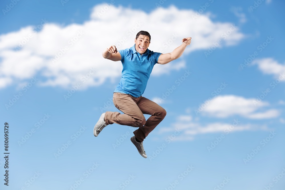 Young fun person jump on sky background Young fun person jump on sky background