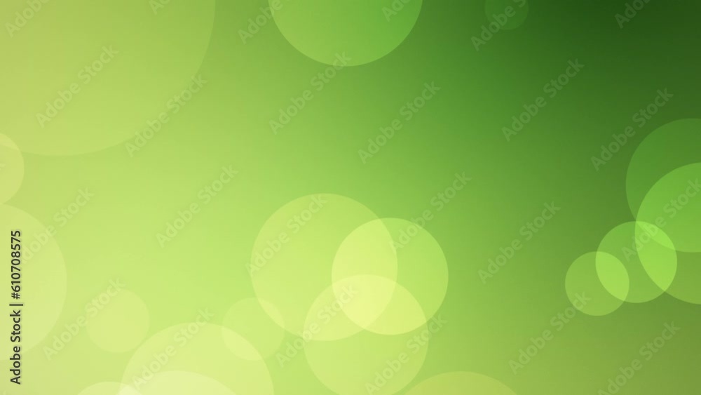 Looped animated green abstract background of floating defocused particles