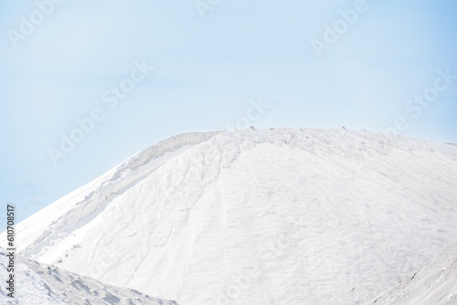 Sea salt piled up into a mountain of the salt production near the town of Aigues-Mortes in the Camarque region of France