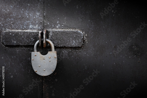 Old rusty lock on metal doors. Lock on the door with an empty place for an inscription