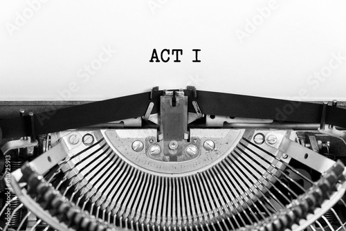 Act one word closeup being typing and centered on a sheet of paper on old vintage typewriter mechanical photo