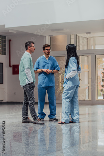 A nurse, medical technician, and doctor engage in a discussion on various medical topics in a modern, high-tech hospital, showcasing teamwork, expertise, and the utilization of advanced technology to