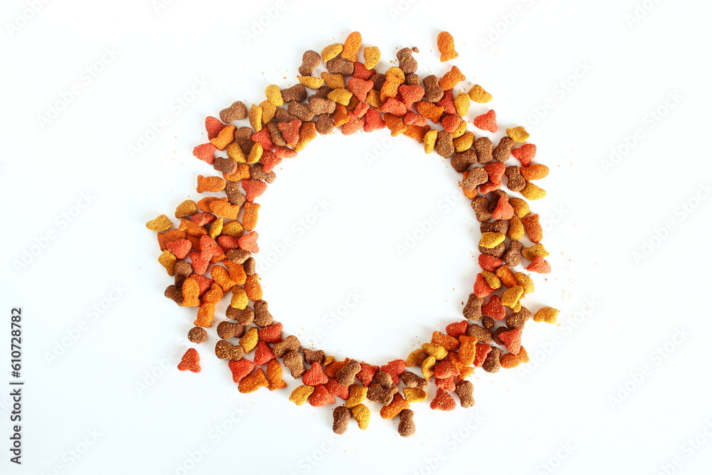 Obraz premium multicolored dried animal or pet food as pet food or health background texture,round frame on white background,top view with copy space 