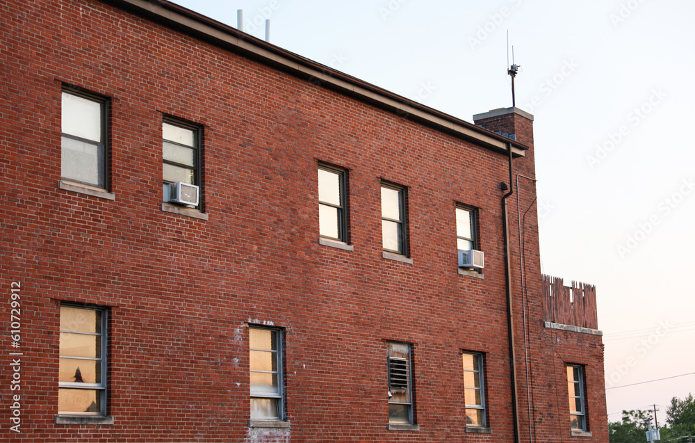 Old brick buildings symbolize timeless elegance, heritage, stability, and a sense of history in the business office environment