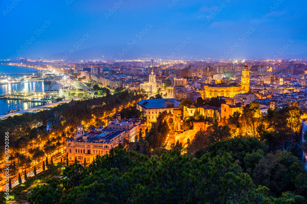 Malaga, Andalusia, Spain: Panoramic aerial view of Malaga coastline, Malaga Cathedral, old town and port at twilight