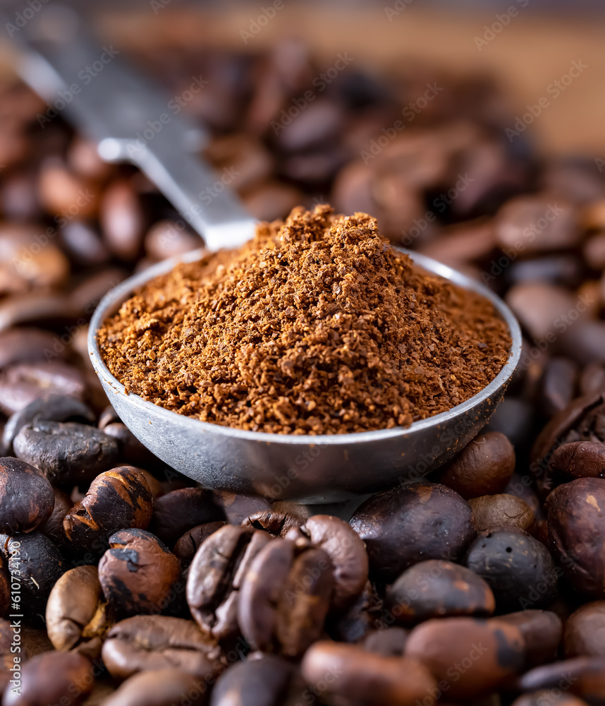 Roasted coffee beans in a metal spoon Roasted coffee beans in a metal spoon