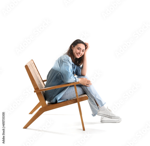 Young woman sitting in wood...