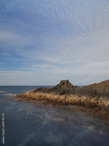 Seascape with cloudy blue sky