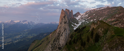 Banner for cover photo of a website or profile. Cover photo of the Saxer Lücke in the Alpstein in the Appenzell Alps in Switzerland. Sunrise glow of the sun. © Philip