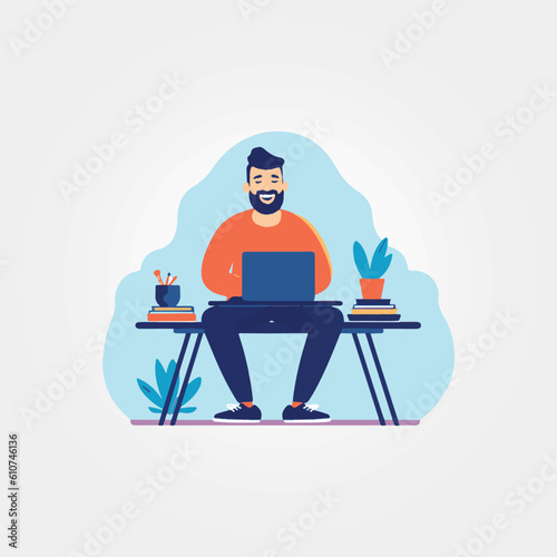 man sitting happily working on his laptop