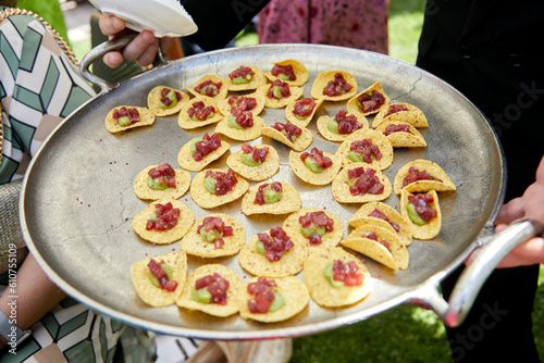 papitas, entrada, catering, copetín, fresco, carne, carne cruda, carne condimentada, aguacate, palta, cebolla photo