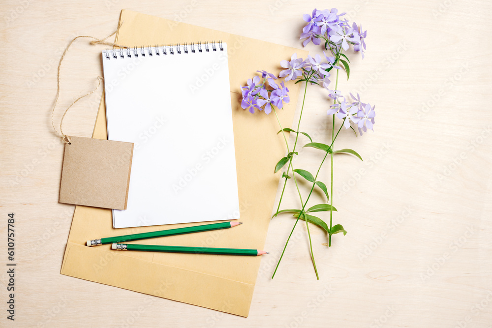Mockup blank notebook, envelope, pencils and blue flowers. Mockup blank notebook, envelope, pencils and blue flowers.