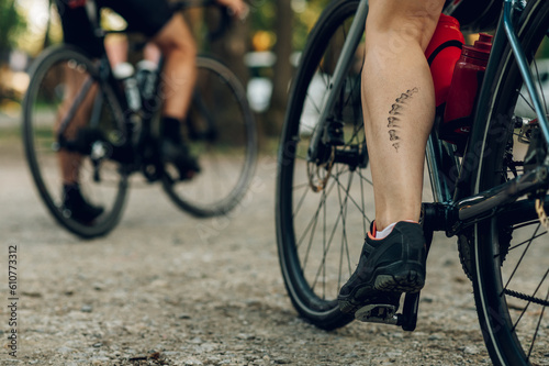 Unrecognizable woman cyclist having a bicycle chain mark on the leg