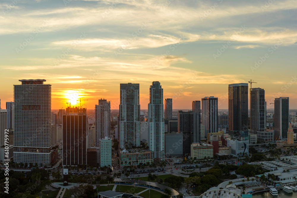 Aerial view of downtown office district of Miami Brickell in Florida, USA at sunset. High commercial and residential skyscraper buildings in modern american megapolis