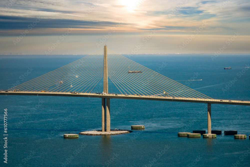 Obraz premium Aerial view of Sunshine Skyway Bridge over Tampa Bay in Florida with moving traffic. Concept of transportation infrastructure
