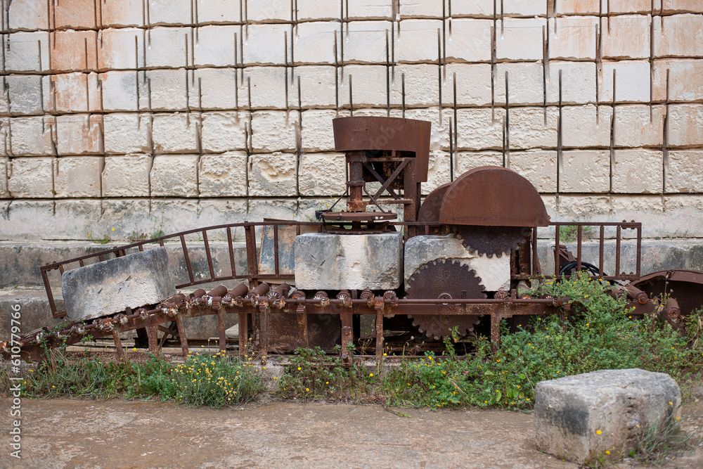 original old rusty sandstone block sizing machine in a depleted quarry