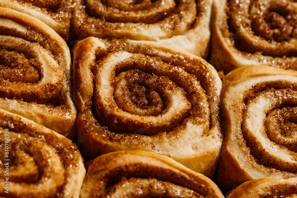 Tasty cinnamon sour dough rolls with sugar. Close up of sweet homemade pastry. Tasty cinnamon sour dough rolls with sugar. Close up of sweet homemade pastry.