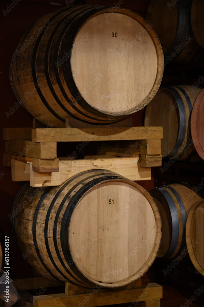 Production of fortified jerez, xeres, sherry wines in dark oak barrels in sherry triangle, Jerez la Frontera, El Puerto Santa Maria and Sanlucar Barrameda Andalusia, Spain