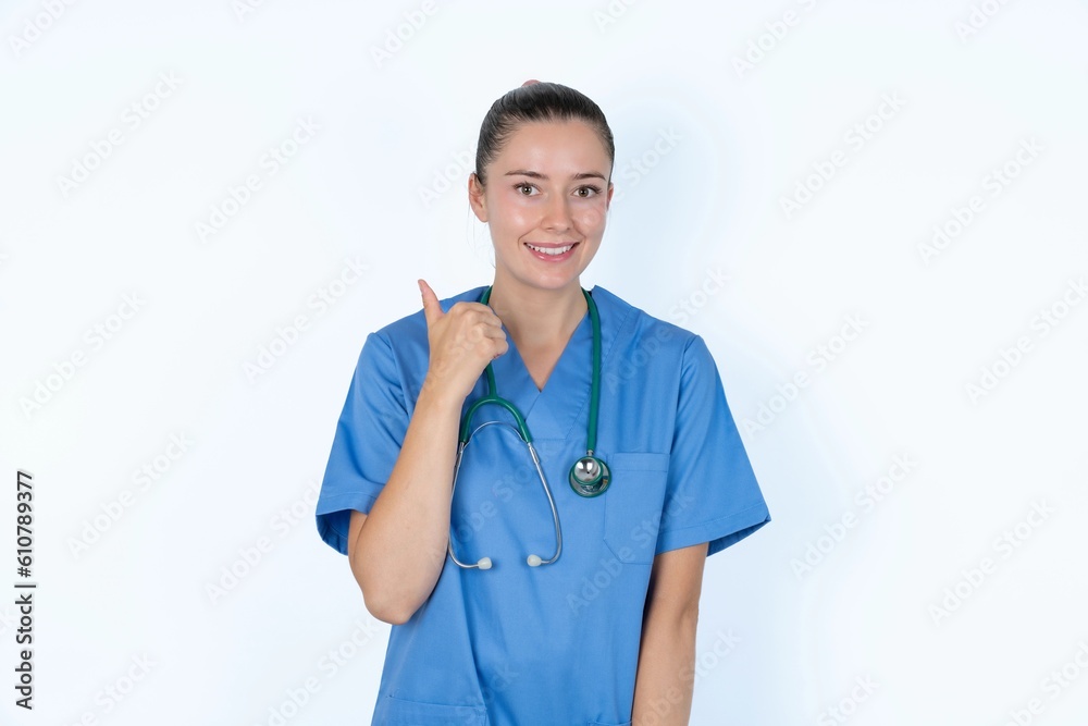 young caucasian doctor woman wearing medical uniform over white background points away and gives advice demonstrates advertisement young caucasian doctor woman wearing medical uniform over white background points away and gives advice demonstrates advertisement