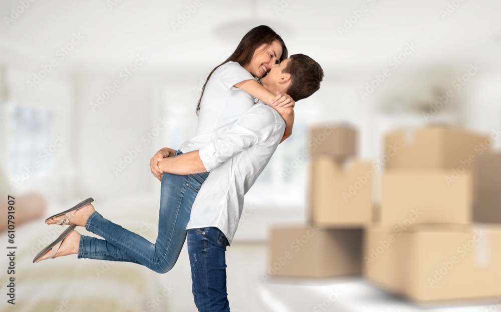 Happy excited couple moving in new house together Happy excited couple moving in new house together