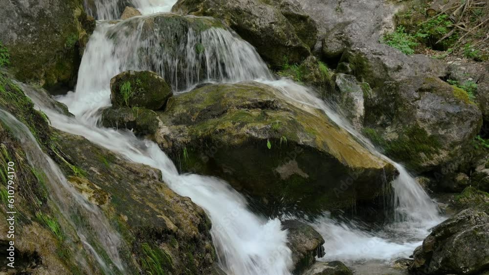 Mountain waterfall with huge moss covered rocks Mountain waterfall with huge moss covered rocks