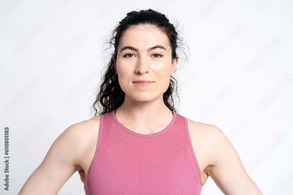 Portrait of a strong muscular build athletic young woman smiling looking at camera Portrait of a strong muscular build athletic young woman smiling looking at camera