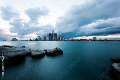 Stormy Detroit skyline view from Windsor, ON. Border cities Canada and Michigan, USA. Corporate buildings and Detroit river. #610803914