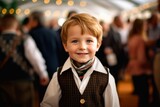 Portrait of a smiling little boy on the background of the Christmas market