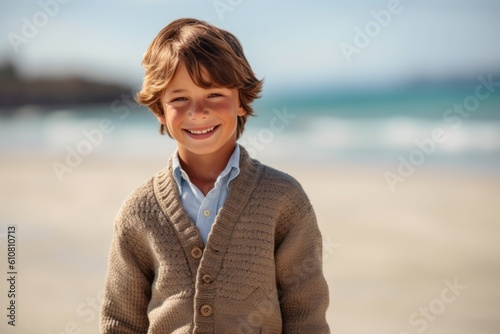 Medium shot portrait photography of a pleased child male that is wearing a chic cardigan against a lagoon or hidden beach background . Generative AI
