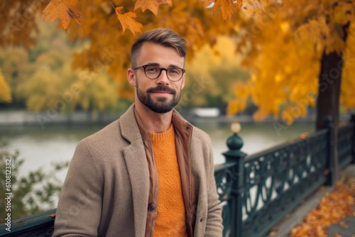 Medium shot portrait photography of a pleased man in his 30s that is wearing a chic cardigan against a picturesque city park during autumn foliage background . Generative AI