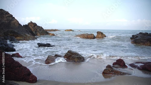 A mesmerizing video of the blue ocean, which beat the surf against the stones,
