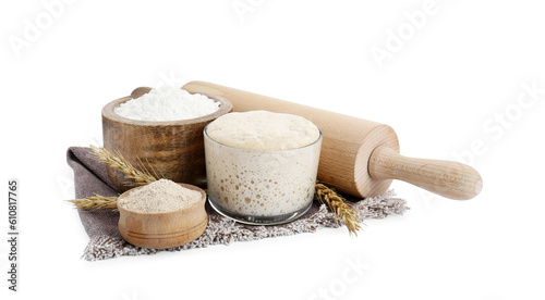 Leaven, flour, rolling pin and ears of wheat isolated on white