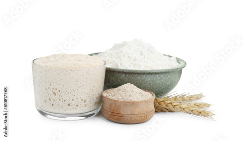 Leaven, flour, and ears of wheat isolated on white