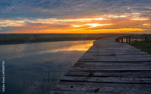 Fototapeta Naklejka Na Ścianę i Meble -  Beautiful river sunset view with pier
