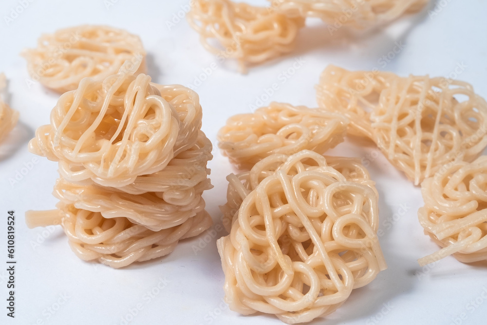 Shrimp chips isolated on a white background, a traditional Indonesian snack that is often served as a side dish Shrimp chips isolated on a white background, a traditional Indonesian snack that is often served as a side dish